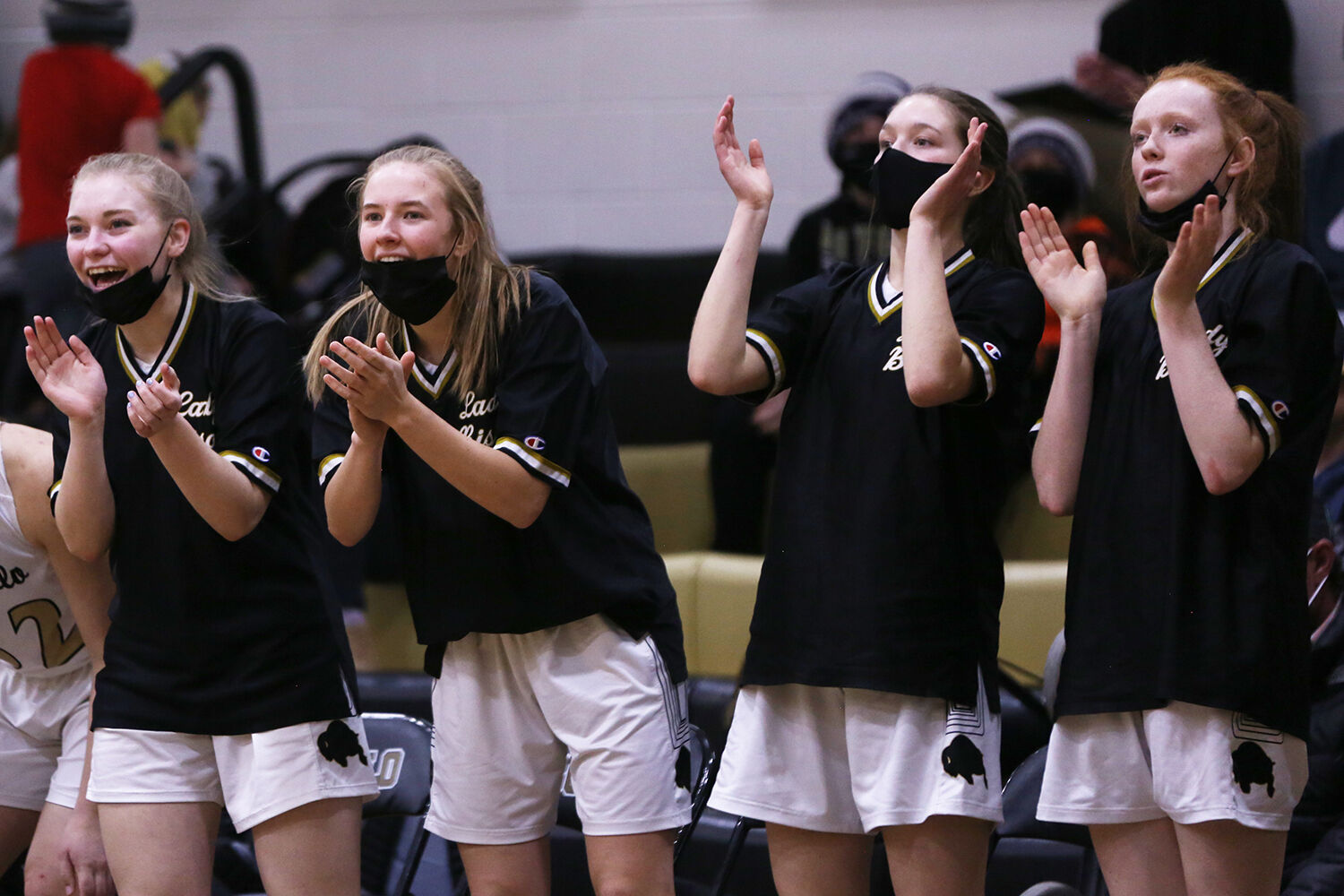 Buffalo High School’s bench jumps up in celebration